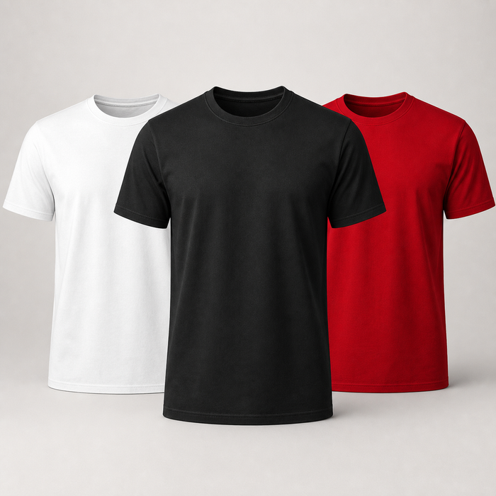 Three plain short-sleeve crew-neck T-shirts shown on a light gray studio background, arranged in a row by color: white on the left, black in the center and foreground, and red on the right.